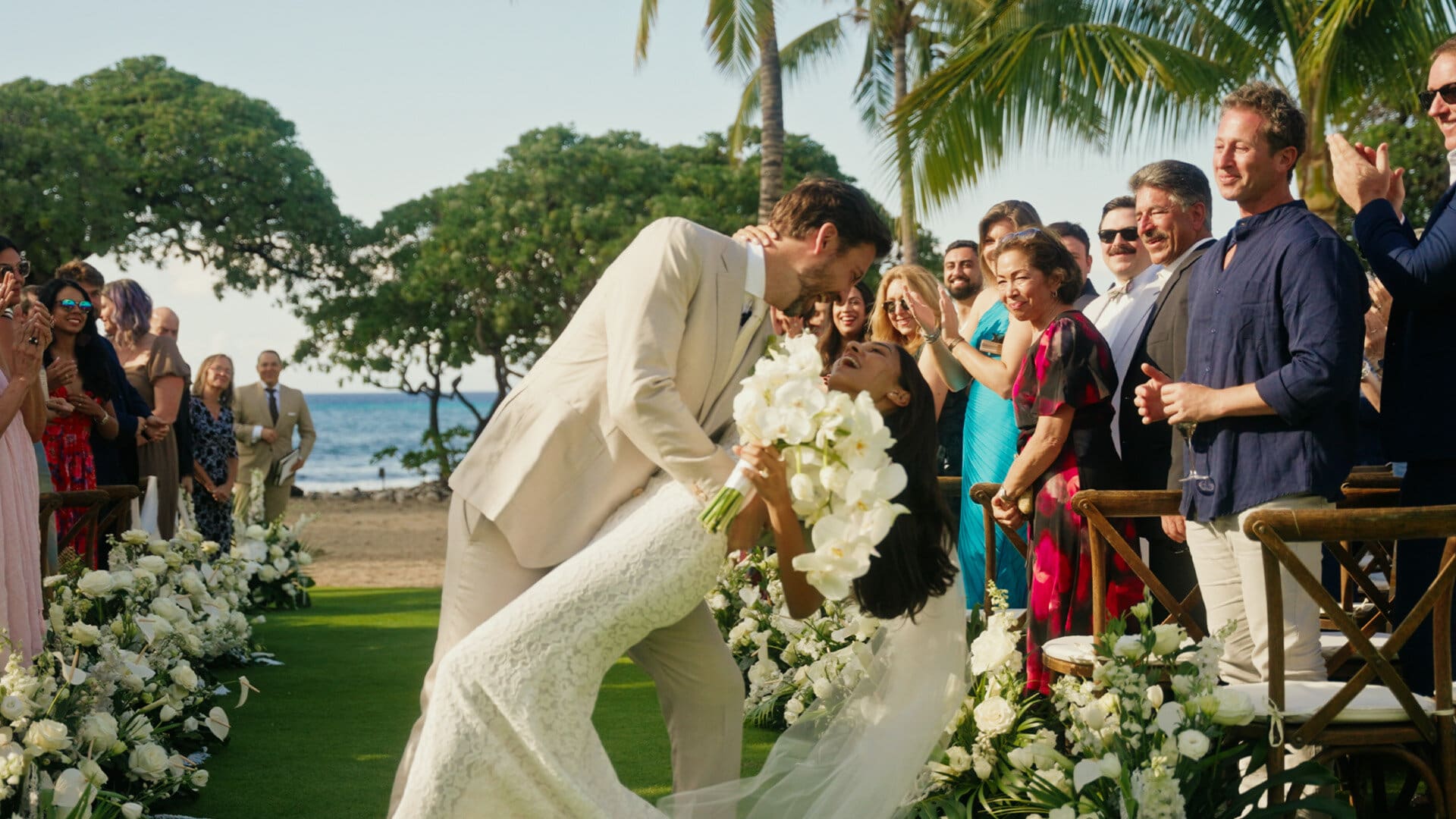 Elegant bride and groom celebrating their luxury wedding at Kona Village, A Rosewood Resort on the Big Island of Hawaii.
