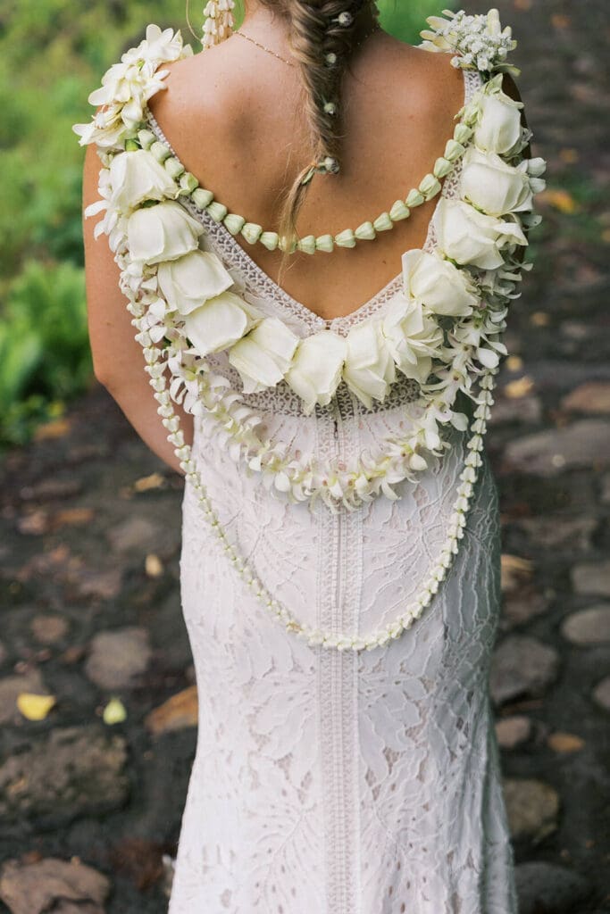 Bride with floral details on her back at Kulaniapia Falls, Big Island Hawaii wedding photography