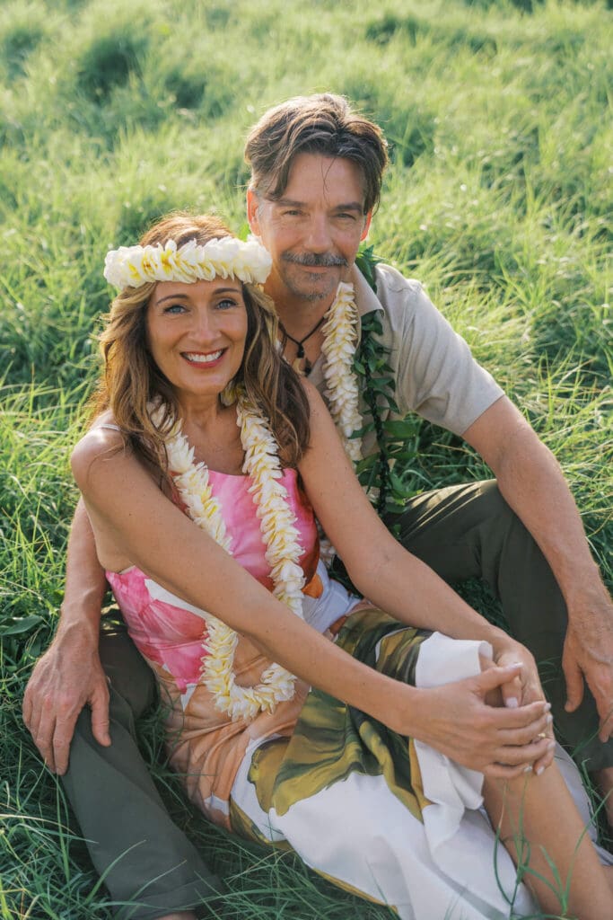 Couple laying in the grass at Old Airport Beach, Kona Hawaii wedding photos