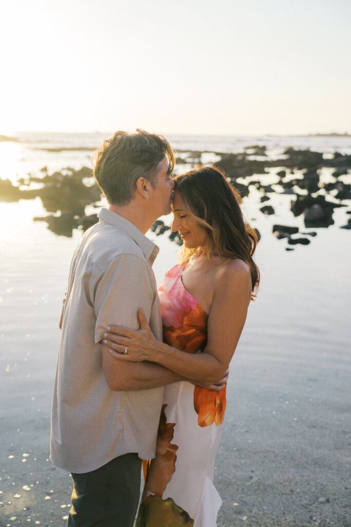 Couple kissing in tide pools at Old Airport Beach, Big Island Hawaii
