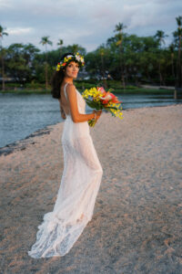 Bride on the beach at sunset during her intimate A-Bay wedding